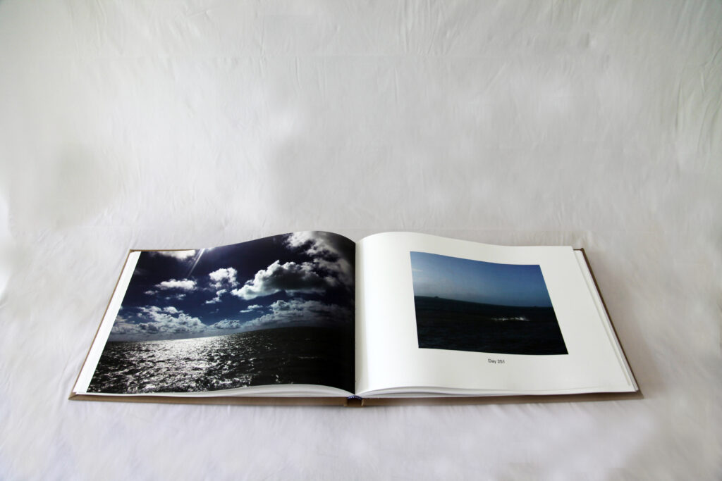 Open book with pictures of the ocean