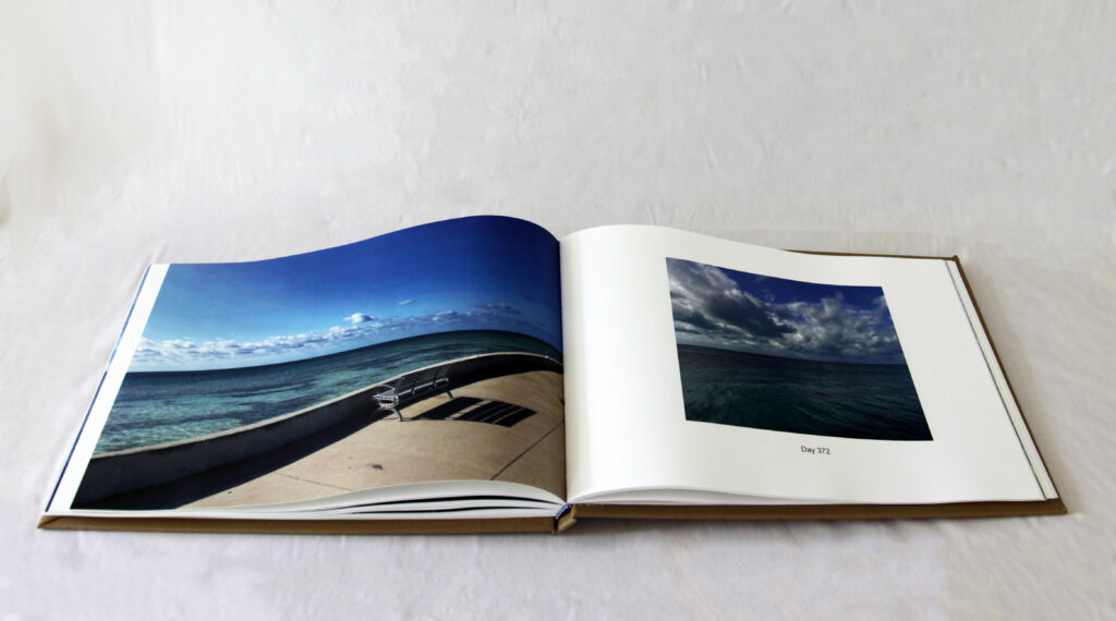 Open book with pictures of the ocean